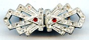 Early 20th century pot metal old buckle with perfectly clear rhinestones accentuted by 2 ruby red rhinestones.