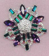 awesome silver brooch encrusted with emerald, amethyst, and irridescent rhinestones