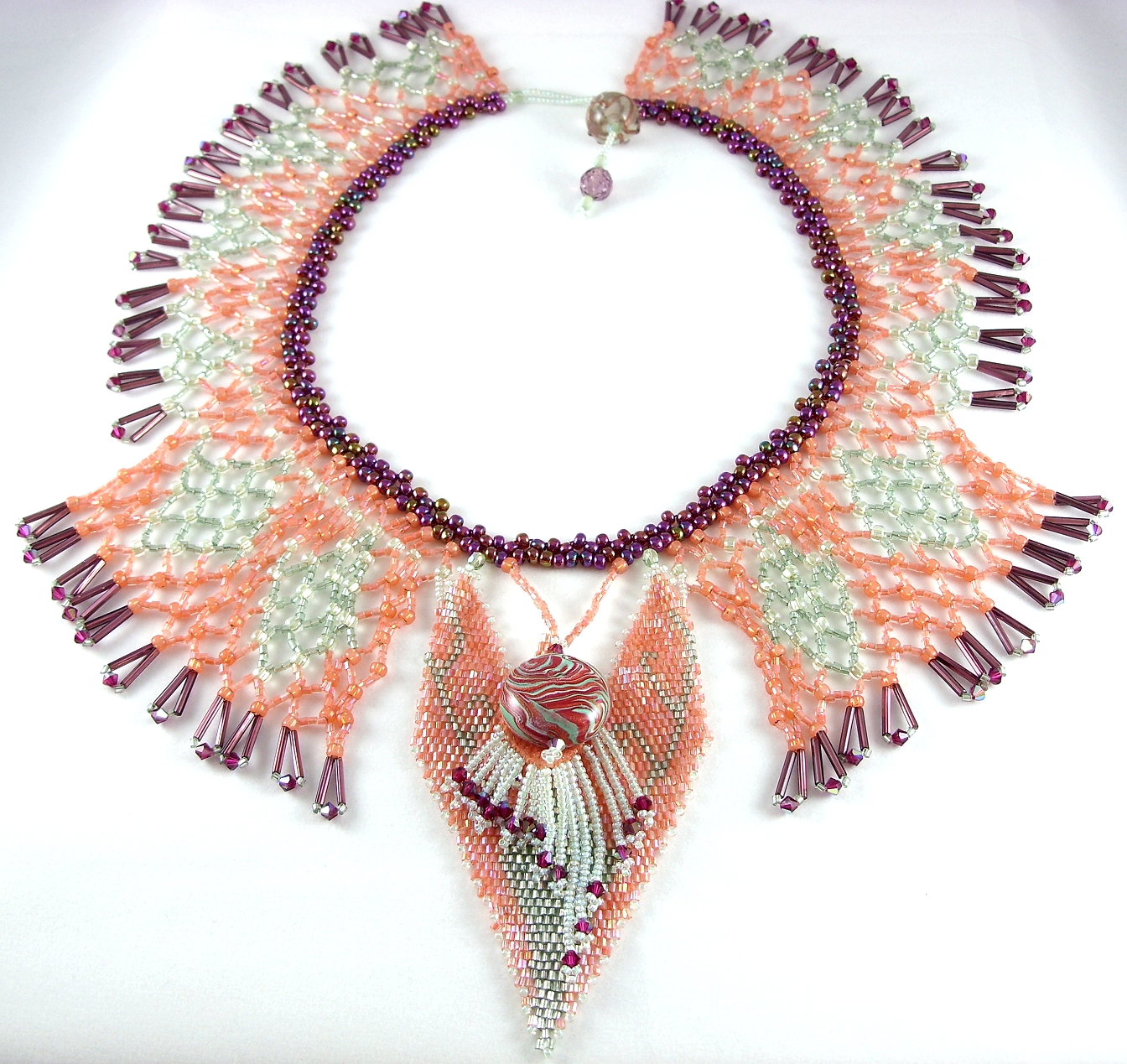 Distinctive pale orange and green elaborate bead weaving neckpiece  Patricia C Vener