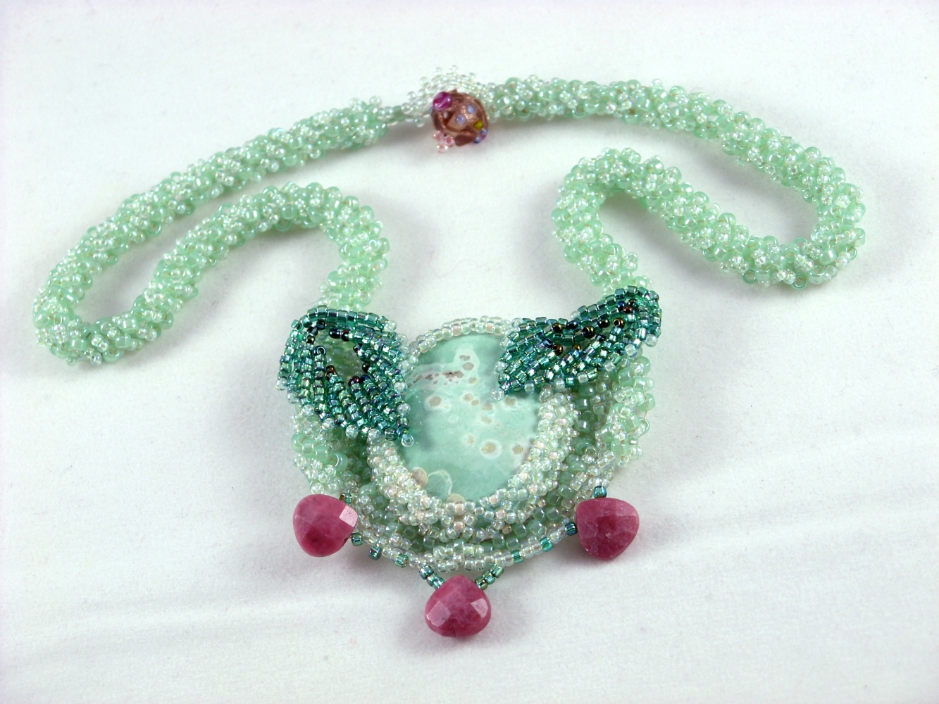 bead woven necklace in sea green bead weaving with polished stone cabochon  Patricia C Vener