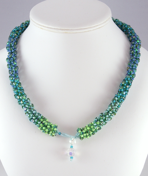 Dryad is a winsome name for a sturdy bead woven necklace celebrating nature's greens