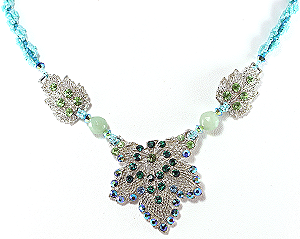 triplet pendant revitalized with colorful rhinestones, gemstomes, and bead weaving  2007, Patricia C Vener